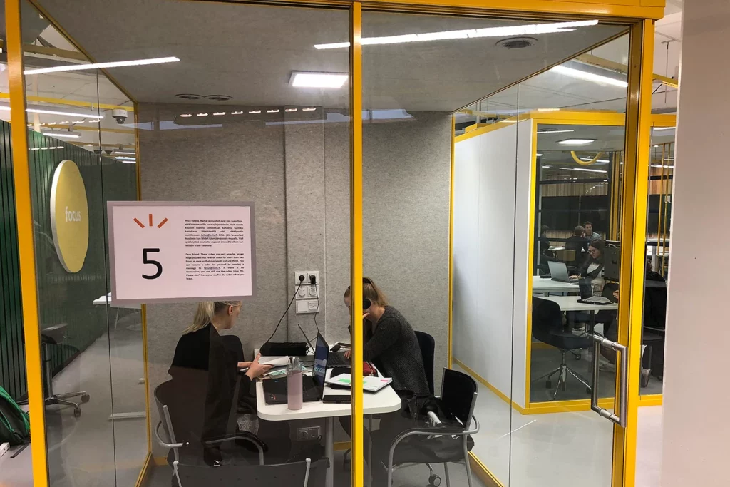 A glass-enclosed group study area